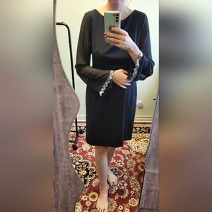 Chic Black Dress with Embellished Sleeves